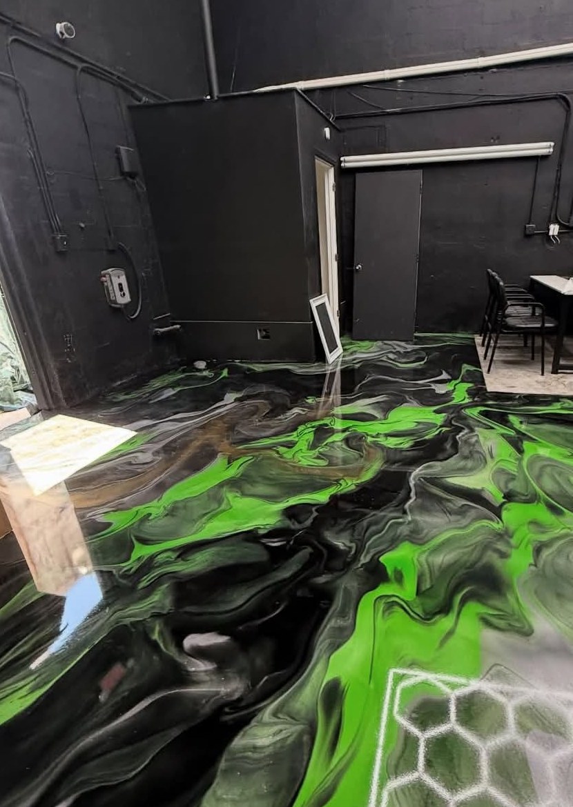 Custom green and black metallic epoxy floor in a modern interior